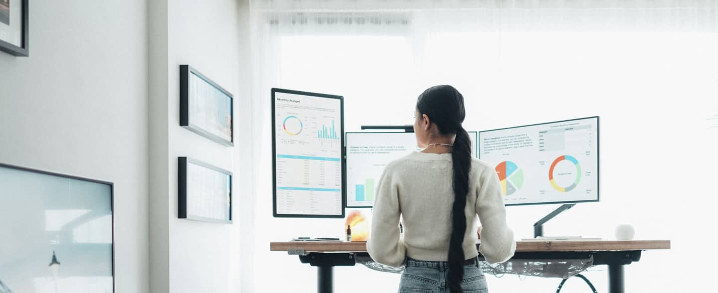 worker at standing desk in an office