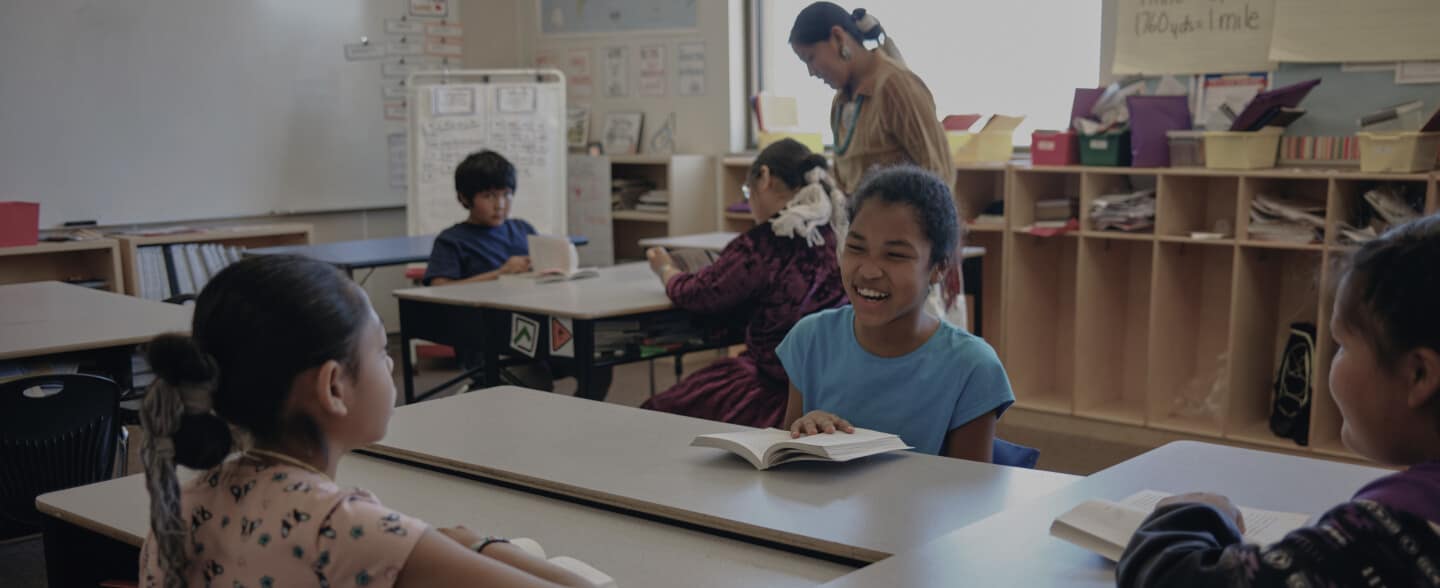 beekmantown-hero Kids in a classroom talking at their desks