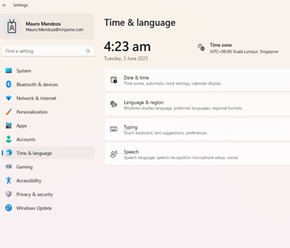 Select Time & Language and then Language & Region