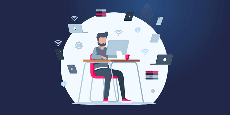 Illustration of an IT worker at their desk representing the topic of IT Documentation Best Practices