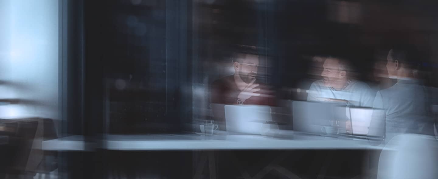 Coworkers talking at a table