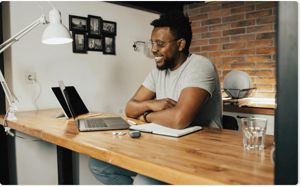 Happy Technician working on a laptop